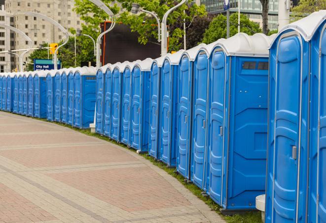 a row of portable restrooms at a fairground, offering visitors a clean and hassle-free experience in maud